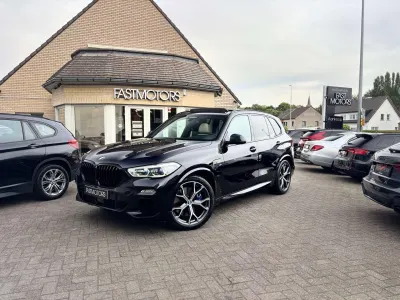 BMW X5 BMW X5 xDrive45e M Sport | Individual Ivory White | Sky Lounge | Laserlights | Massage | Achterwielbesturing  | Softclose